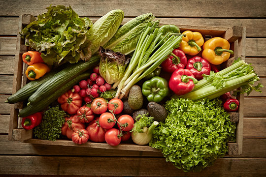 Still life fresh, organic, healthy vegetable harvest variety in wood crate