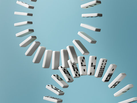 Interconnecting domino wheels on blue background