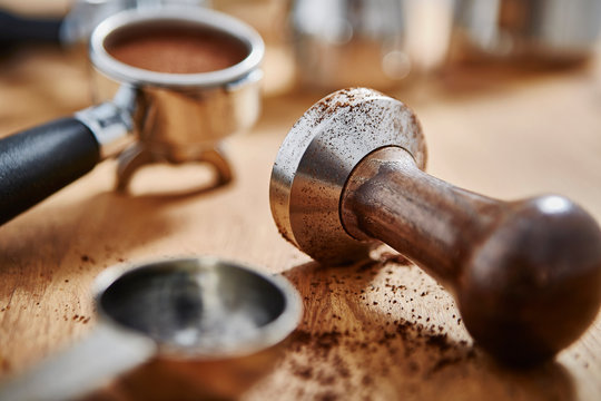 Close up coffee tamper and espresso