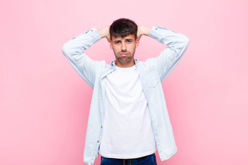 young handsome man feeling frustrated and annoyed, sick and tired of failure, fed-up with dull,...
