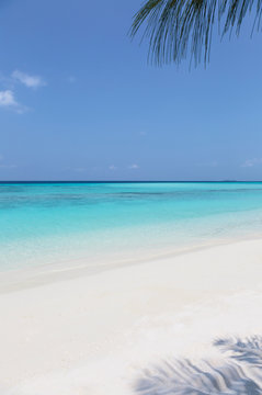 Tranquil, sunny beach and blue ocean, Maldives, Indian Ocean