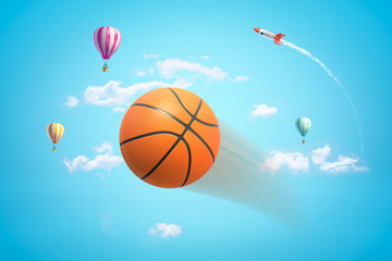 3d rendering of an orange basketball flying in bright blue sky with hot air balloons and rocket in distance.
