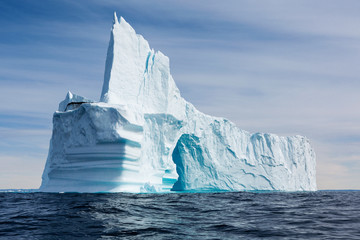 Majestic iceberg formation on sunny blue Atlantic Ocean Greenland