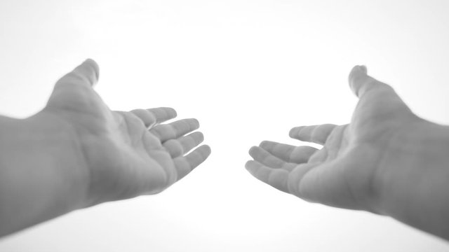 Point of view video shoot of woman raising empty hands up to sun. Slow motion full hd footage.