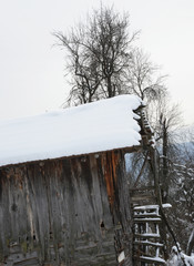 wooden house in the snow