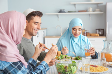 Muslim family having dinner at home