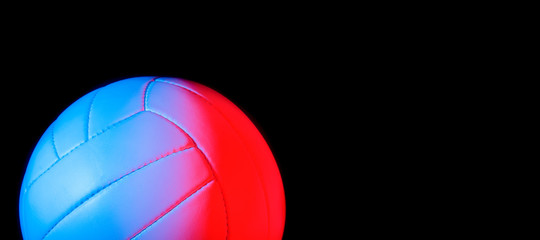 Volleyball ball isolated on black background. Blue neon Banner Art concept