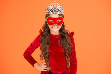 Fototapeta na wymiar Success is state of mind. Happy girl enjoy success orange background. Little child being excited about success. Small kid wear carnival mask. Crown of success. Successful and proud