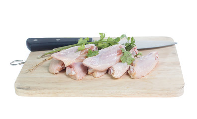Raw chicken  on cutting board on white background