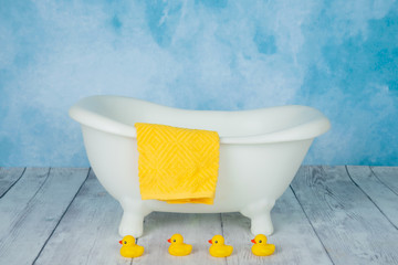 bathroom floor with yellow rubber ducks duckies