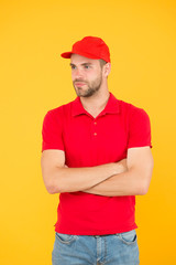 friendly shop assistant. food order deliveryman. cashier vacancy. Fast and free parcel delivery. dealer yellow wall. Salesman cashier career. man delivery service in red tshirt and cap