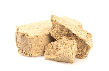 Sunflower halva isolated on white background. Sweet halva dessert slices.