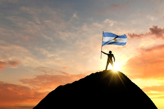 Argentina flag being waved at the top of a mountain summit. 3D Rendering