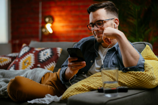 Young man having a video call. Handsome man talking on his smartphone.