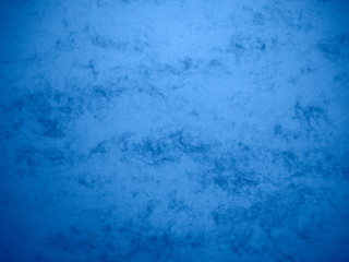 Abstract sky blue blank watercolor paper sheet, textured background with cloudy pattern.