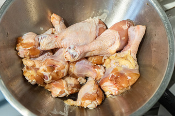 Raw Fresh Chicken Drumsticks on the bowl.