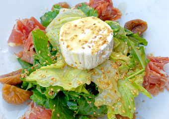 green salad with italian prosciutto and ricotta cheese plate