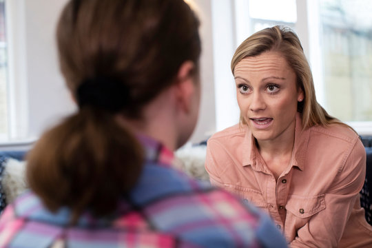 Mother Having Serious Conversation With Young Daughter At Home