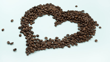 Heart of coffee beans on a white background