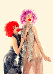 Attractive playful young women ready for carnival parties. Lifestyle and the concept of friendship:...