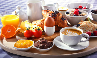 Breakfast served with coffee, juice, croissants and fruits