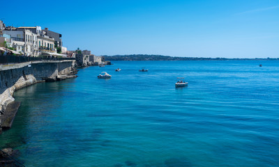 Fototapeta na wymiar The coastline of Ortigia, Siracusa Province (Southern Italy) during summertime.