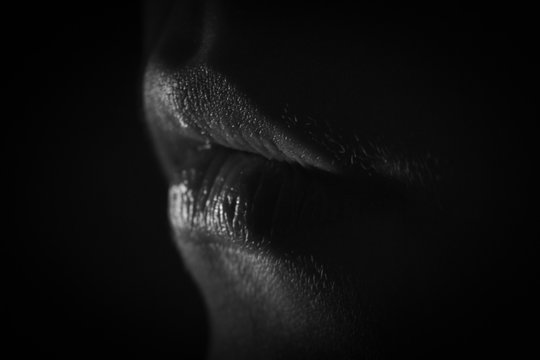 Beautiful lips in the dark.