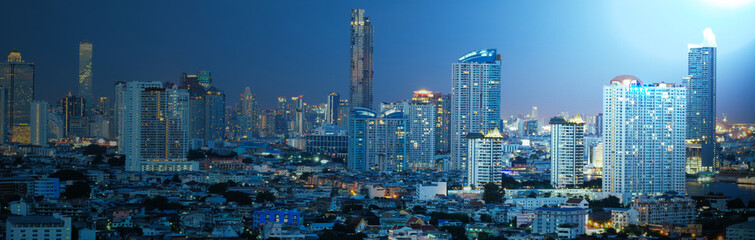 Fototapeta premium panorama city night view banner for web design on blue background color, moon light at top right of pic