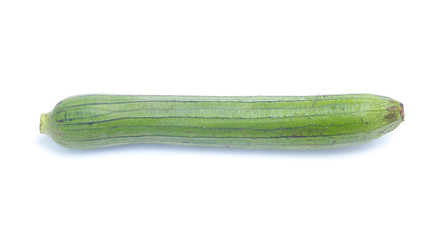 fresh green sponge gourd or luffa with slice isolated on white background