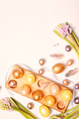 Gold easter decorations on colorful background. Template, banner. Flat design element. Festive background.