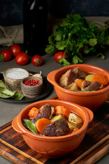 Goulash with large pieces of beef and vegetables. Burgundy meat. Slow stewing, cooking.