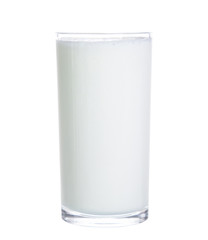 pouring milk in glass isolated on white background