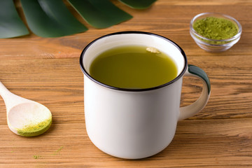 traditional green matcha tea on a wooden table