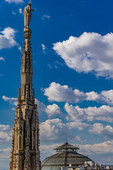 White marble spires on the roof of famous Cathedral Duomo di Milano in Milan, Italy