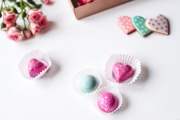 Gift set with hand made sweets in a box on a white table. Flat lay, top view.