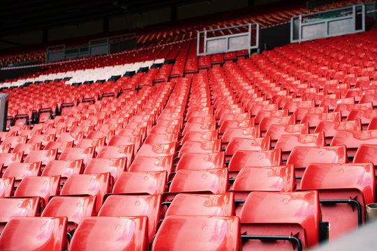 Bright red stadium seat in Liverpool.