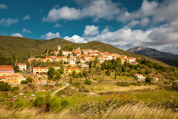 Fototapeta premium Cucugnan, a typical small French village in the Corbieres mountains, at the foot of Cathar castle, Queribus