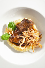 Beef Cheeks with Mashed Potatoes, Greens and Onion Fries