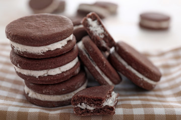 Tasty chocolate cookies on table