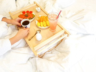 Obraz na płótnie Canvas Healthy breakfast in bed for a girl in a cozy bedroom.
