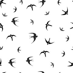 Flying swallows on a white background. seamless pattern. vector illustration