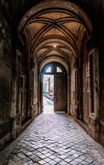 Fototapeta premium Old door to the courtyard. The architecture of the ancient city