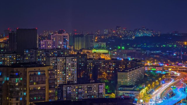 4K. Car Traffic On Night Streets Of Kiev City, Ukrain. Timelapse. Scenic Aerial View Of A Big City At Night Timelapse.  Timelapse View Of The Kiev City Skyline At Dusk With Traffic Moving At Night