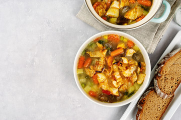 Top view of detox cabbiage soup in a white bowl