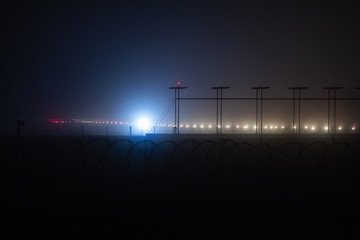 runway in fog and strobe line mist navigation