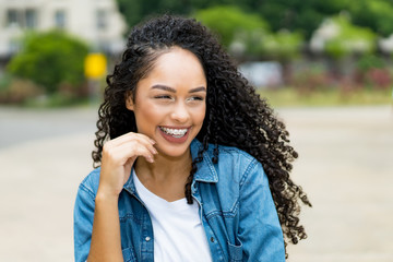 Beautiful brazilian young adult woman with retainer