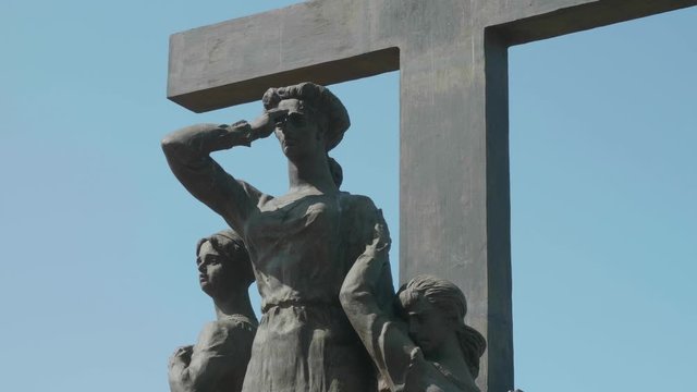Close up view of part of sculpture on Ekaterinburg. Queen and children near cross
