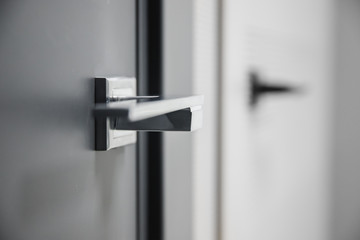 Fototapeta Metal doors knob handle on modern interior obraz