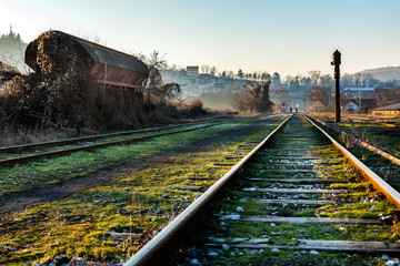 Old railway tracks in the autumn sunset