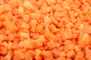 fresh carrots cut into cubes close up